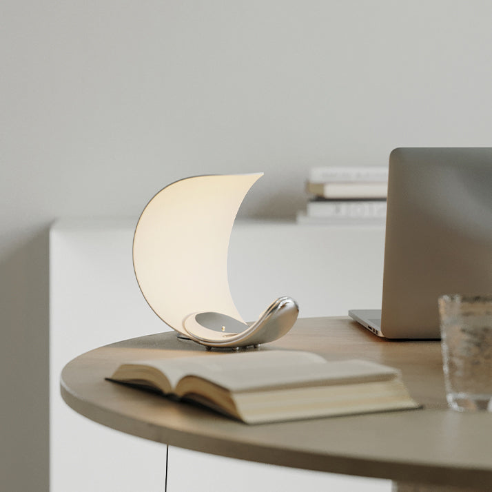 Liora Curved Table Lamp With Elegant Swirls And Soft Glow