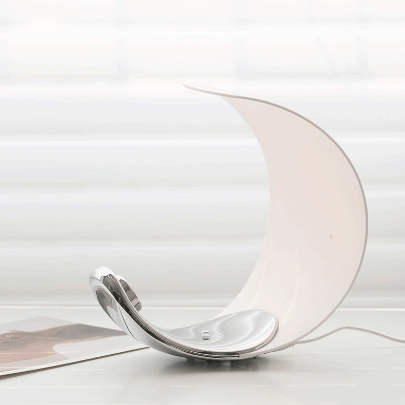 Liora Curved Table Lamp With Elegant Swirls And Soft Glow