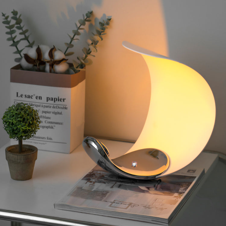 Liora Curved Table Lamp With Elegant Swirls And Soft Glow