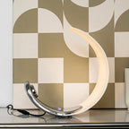 Liora Curved Table Lamp With Elegant Swirls And Soft Glow