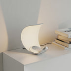 Liora Curved Table Lamp With Elegant Swirls And Soft Glow