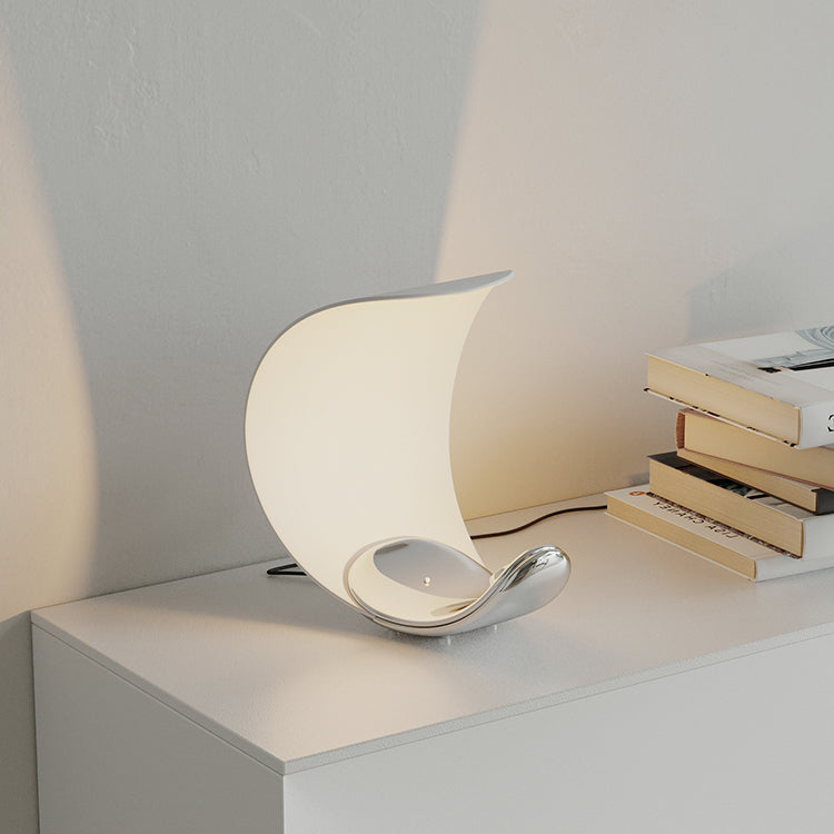 Liora Curved Table Lamp With Elegant Swirls And Soft Glow