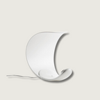 Liora Curved Table Lamp With Elegant Swirls And Soft Glow