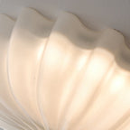 LuminaPetal Ceiling Lamp With Organic Curves And Warm Glow